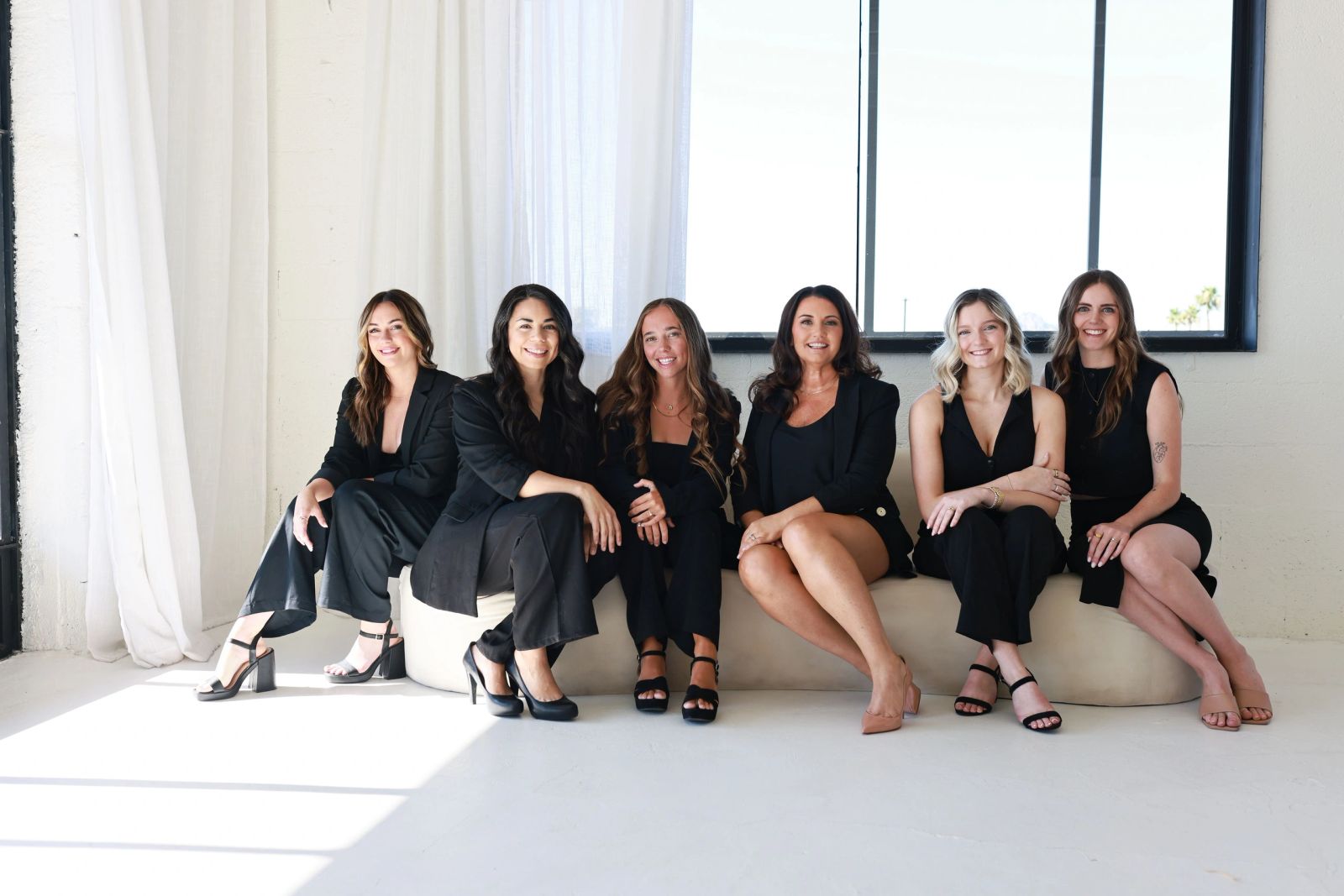 Kristi and members of the Kristi Marie Events team seated together in their studio