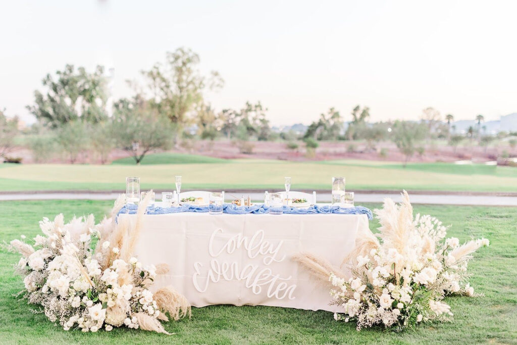 How to set your wedding budget - view of table in grassy area